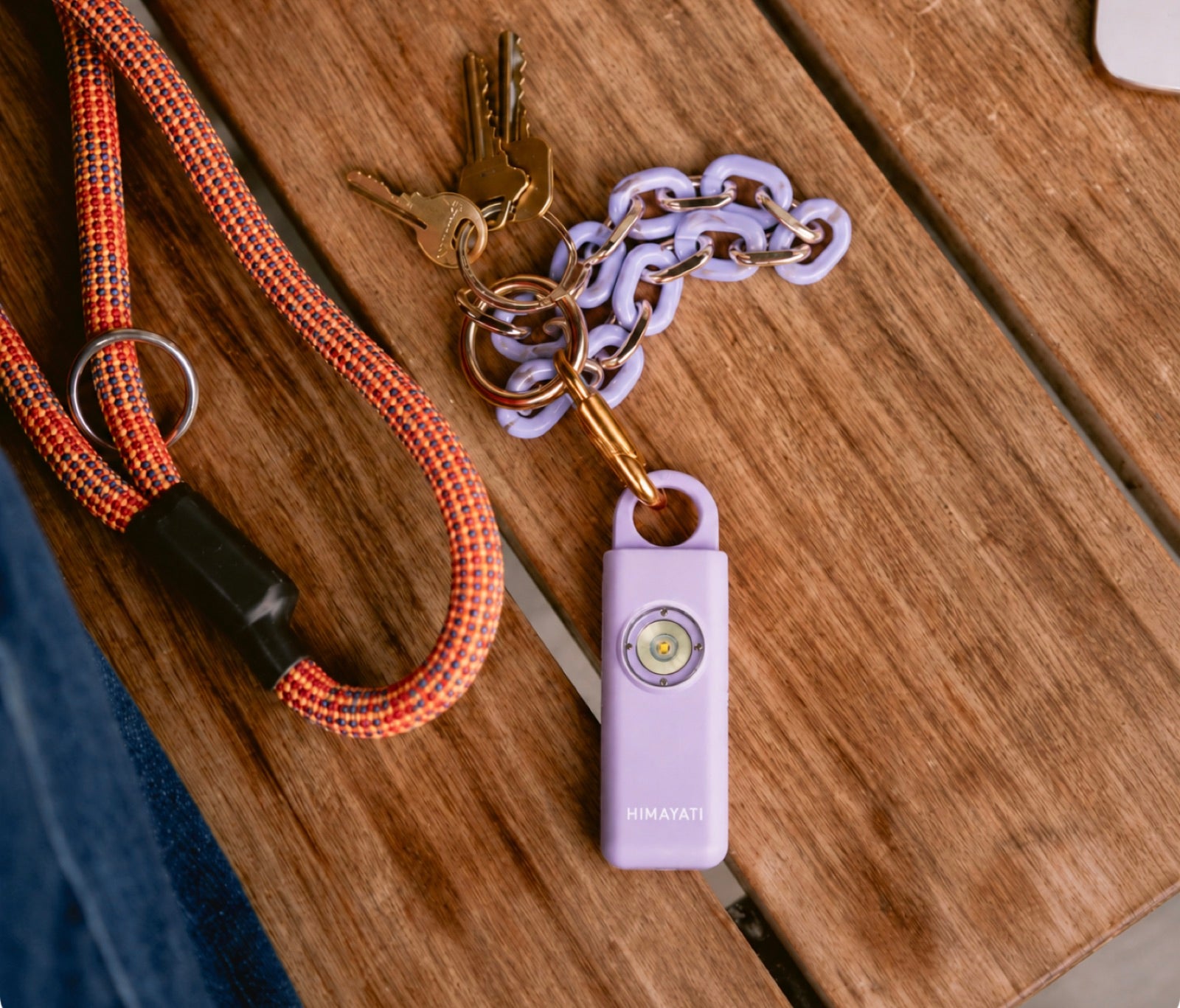 Himayati alarm on a keychain beside house keys