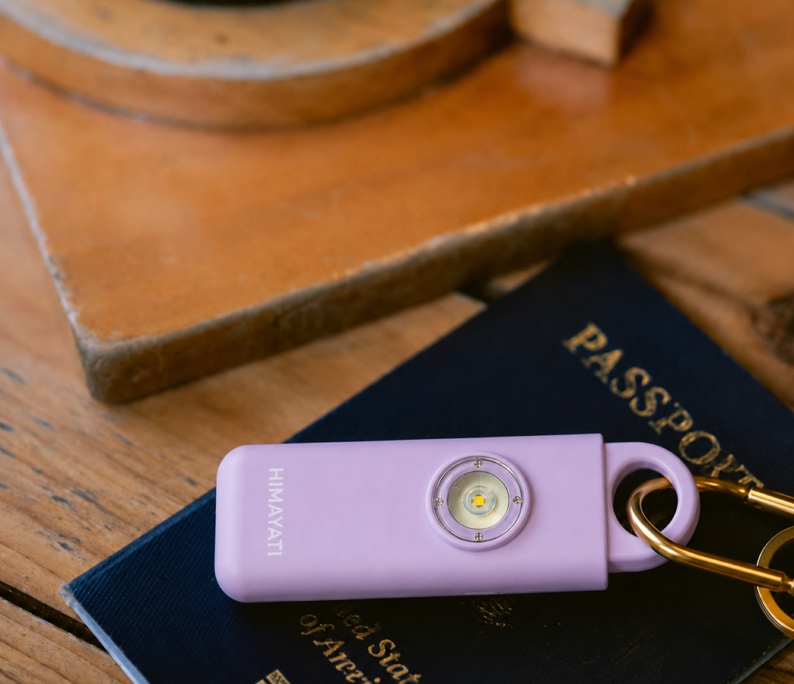 Himayati alarm resting on a passport